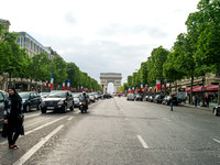 The Arc de Triumphe while walking across the Champs Elysees, Paris